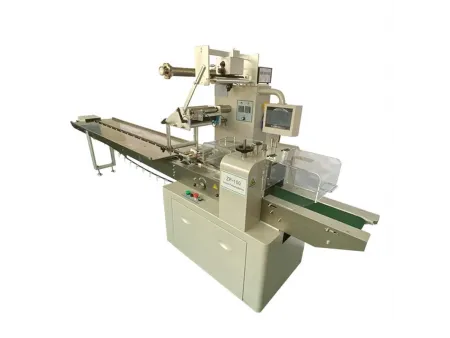 ماكينة تعبئة وتغليف أفقية (ذات بكرة علوية) Horizontal Flow Wrapping Machine (Upper Reel)